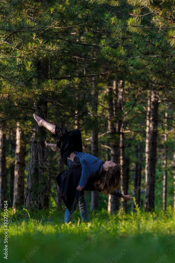 Beautiful couple dancing hip-hop in nature Beautiful couple dancing hip-hop in nature