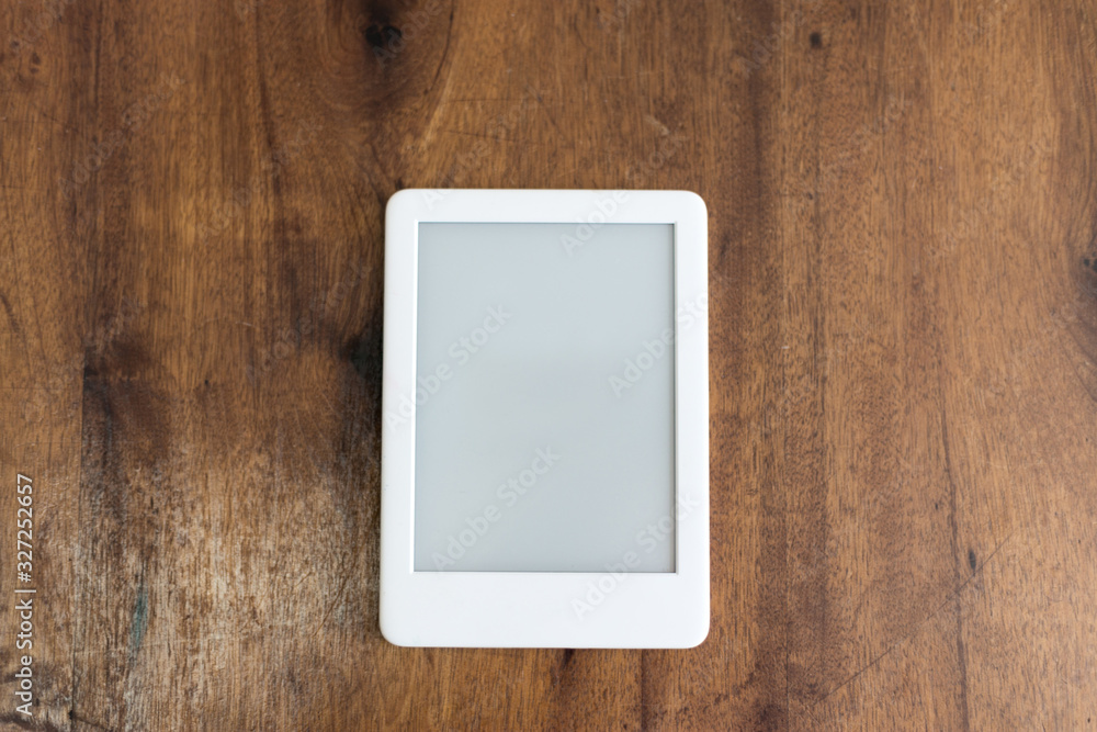 white digital book on the wooden table white digital book on the wooden table