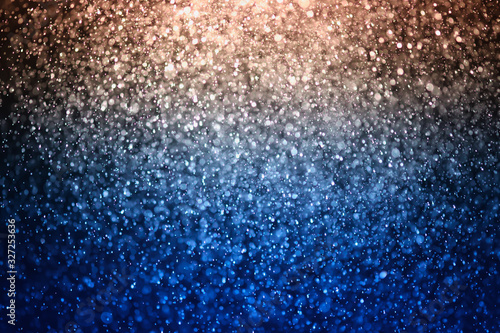 glitter bokeh of light background .Abstract blurred light.blue and gold color