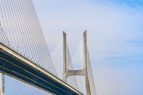 Closeup fragment of Vasco da Gama bridge, a cable stayed bridge flanked by viaducts and rangeviews that spans the Tagus River in Lisbon, Portugal