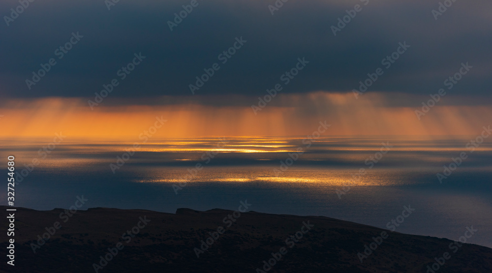 Crepuscular rays illuminating the sea off the Dorset coastline