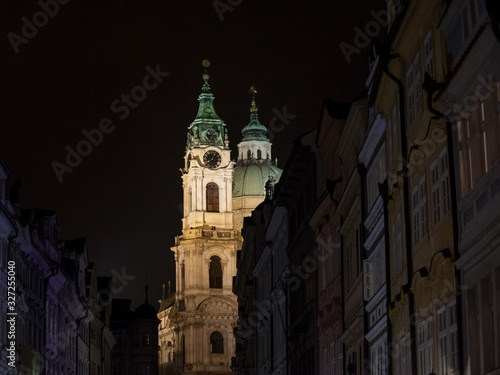 Kostel Svety Mikulase Church (Saint Nicholas) illuminated at night in prague, in the Mala Strana district of Medieval Prague, Czech Republic. It is a Catholic Baroque church
