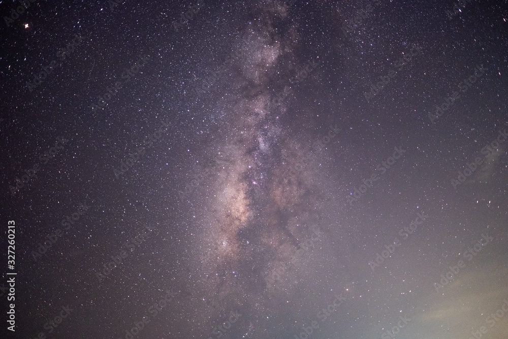 Fototapeta premium The stars and the milky way in the dark sky at night are very beautiful.