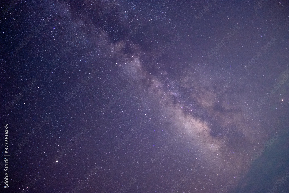 The stars and the milky way in the dark sky at night are very beautiful.