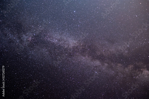 The stars and the milky way in the dark sky at night are very beautiful.