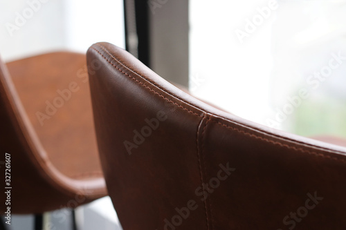 Close up detail of brown leather stools