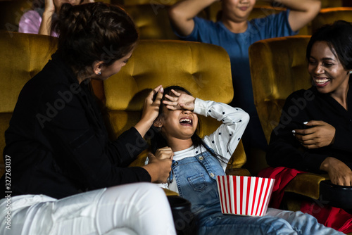 The girls cried loudly in the cinema, causing annoyance to the people sitting next to and behind them. photo