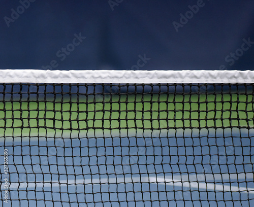 Tennis net closeup and isolated in indoor facility © Brett