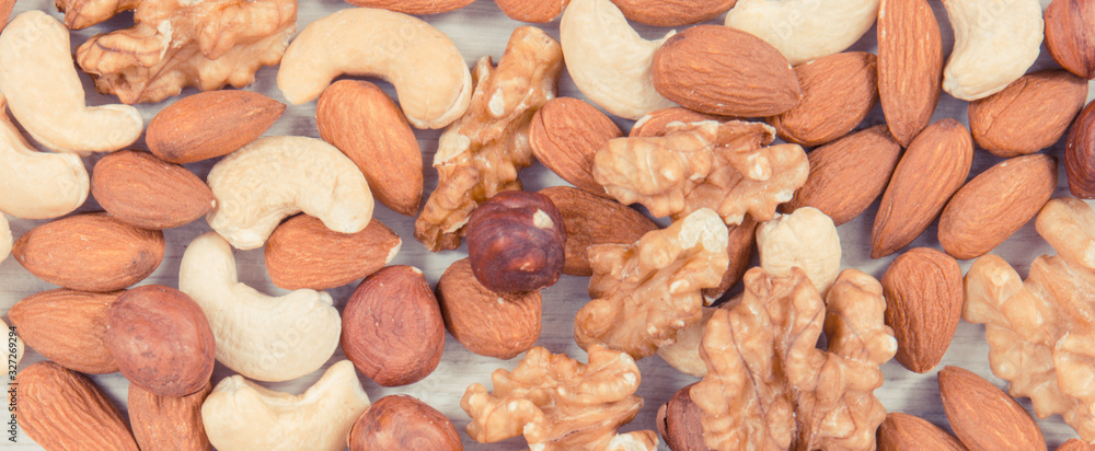 Fototapeta premium Various nuts and almonds, healthy nutrition and lifestyle
