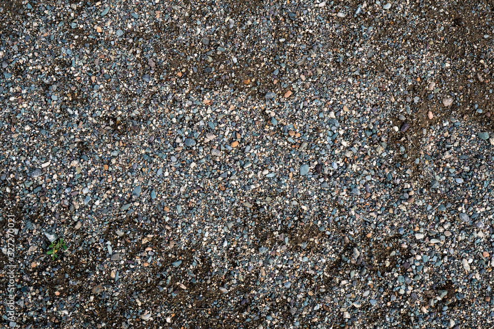 The texture of a shallow river stone. Pebble Background Image