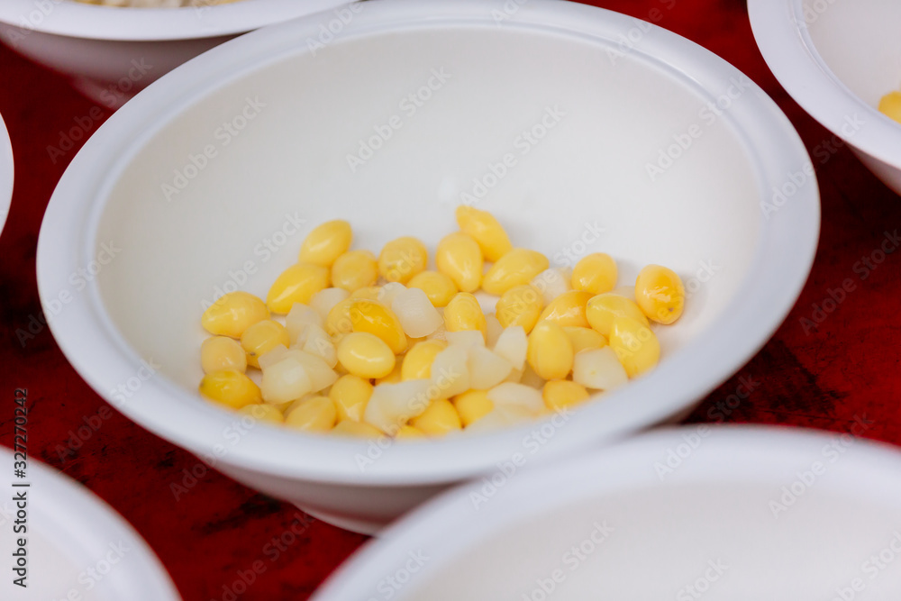 Ginkgo Nuts in Syrup and young Coconut in white bowl on napkin. Fresh Yellow Ginkgo in the blow. Ginkgo nuts (Ginkgo Biloba) have high nutrition and vitamin. Dessert menu,Dessert food Ginkgo Nuts in Syrup and young Coconut in white bowl on napkin. Fresh Yellow Ginkgo in the blow. Ginkgo nuts (Ginkgo Biloba) have high nutrition and vitamin. Dessert menu,Dessert food