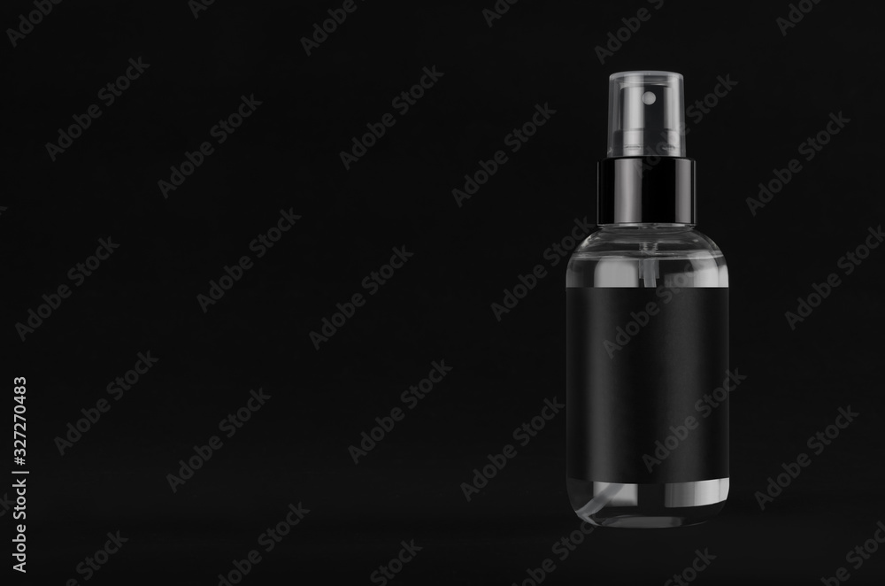 Elegant transparent spray dispenser bottle for cosmetics with black label on black background, mock up for branding, design, copy space. Elegant transparent spray dispenser bottle for cosmetics with black label on black background, mock up for branding, design, copy space.
