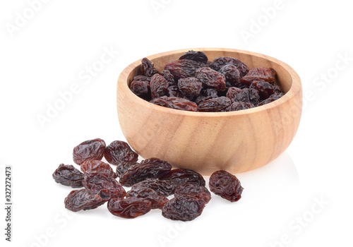 raisins in a bowl isolated on white background