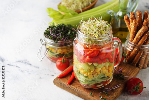 Vegan salad in with microgreens in a jar