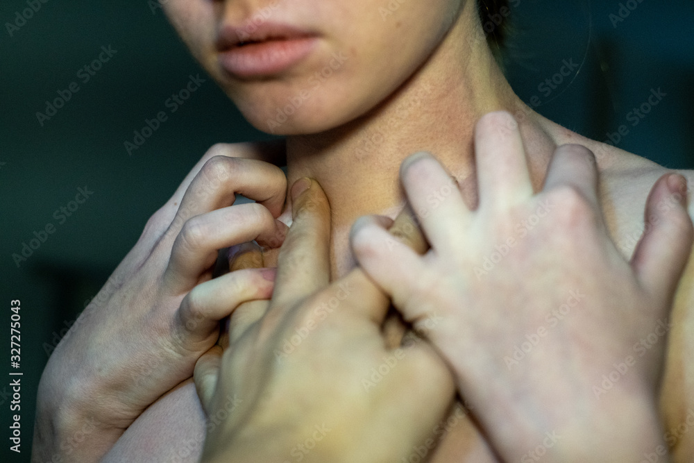 many hands on the girl's face on a black background