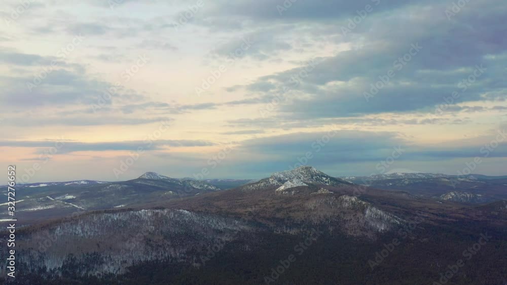 Flight over the winter forest and snow-capped mountains Flight over the winter forest and snow-capped mountains