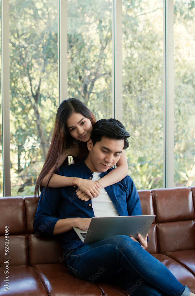 A couple is sitting in living room A couple is sitting in living room