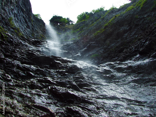 Waterfall Hochfall (Wassersturz Hochfall or Wasserfall Hochfall) in the Rhine river valley, Mainfeld - Canton of Grisons (Graubünden or Graubuenden), Switzerland photo