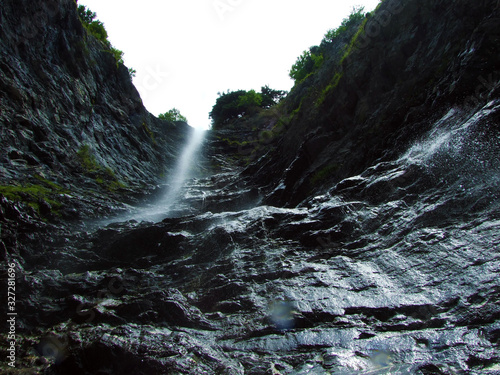 Waterfall Hochfall (Wassersturz Hochfall or Wasserfall Hochfall) in the Rhine river valley, Mainfeld - Canton of Grisons (Graubünden or Graubuenden), Switzerland photo