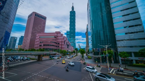 Taipei 101 tower with traffic on road in Taipei, Taiwan