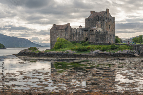 Eilean Donan Castle with its reflection on the waters of Loch Duich  Dornie  Scotland. Concept  fantastic and mythological places  travel to famous places in Scotland