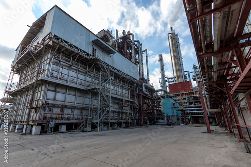 General view of the chemical furnace at a chemical enterprise producing mineral fertilizers, nitrogen, ammonia, nitric acid, phosphate fertilizers. View in the daytime, during the day.