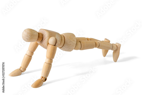 Wooden figure doing push-ups