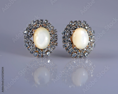 Gold & pearl made earrings isolated-