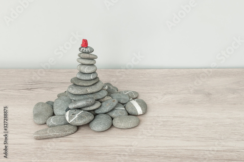 Stack of stones on wooden table  space for text. Zen concept
