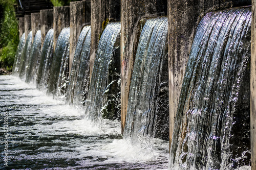 Waste water treatment plant. Modern urban wastewater treatment plant. Cold transparent water of decorative artificial waterfall.