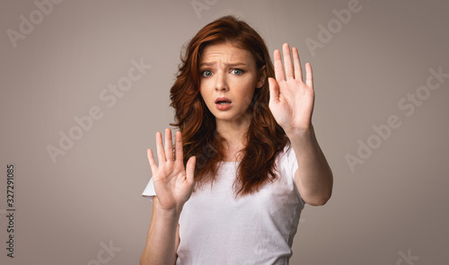 Scared Girl Gesturing Stop Warning About Danger, Studio Shot