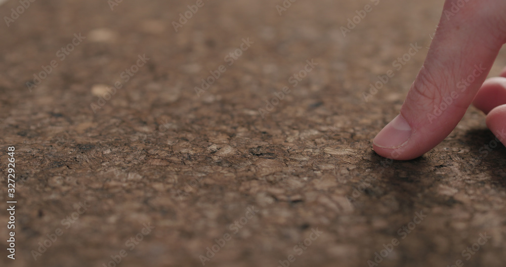 man hands touch dark cork surface man hands touch dark cork surface