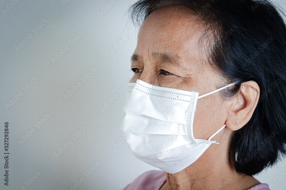 Elderly women wearing masks, covering their mouths and noses, preventing coronavirus or COVID-19. And pm 2.5 dust. Senior health concepts Elderly women wearing masks, covering their mouths and noses, preventing coronavirus or COVID-19. And pm 2.5 dust. Senior health concepts