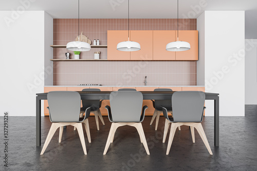 Brown and white kitchen with dining table