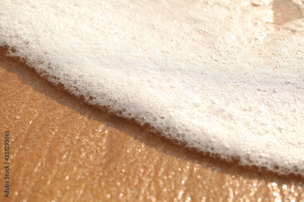 foam on sandy tropical ocean beach foam on sandy tropical ocean beach