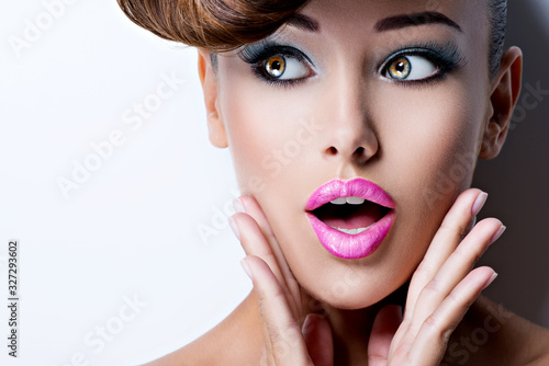 face of beautiful woman with fashion vivid color makeup
