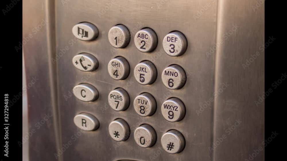 Numeric keypad of an old Italian telephone booth in the city Numeric keypad of an old Italian telephone booth in the city
