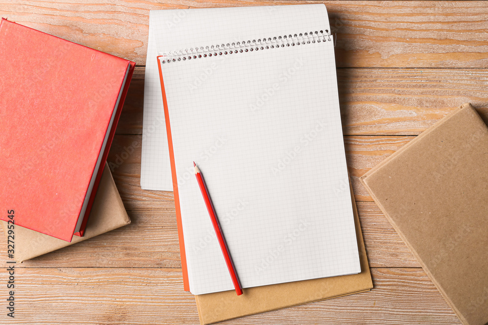 Notebooks and pencil on wooden table Notebooks and pencil on wooden table