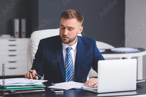 Male accountant working in ...