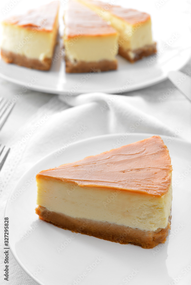 Slice of sweet caramel cheesecake on plate Slice of sweet caramel cheesecake on plate
