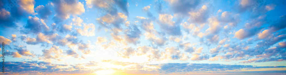 Beautiful blue sky clouds background. Landscape with clouds and sun on sky Beautiful blue sky clouds background. Landscape with clouds and sun on sky