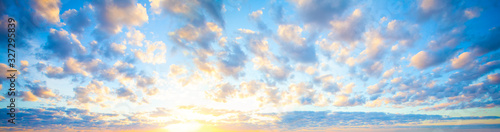 Beautiful blue sky clouds background. Landscape with clouds and sun on sky