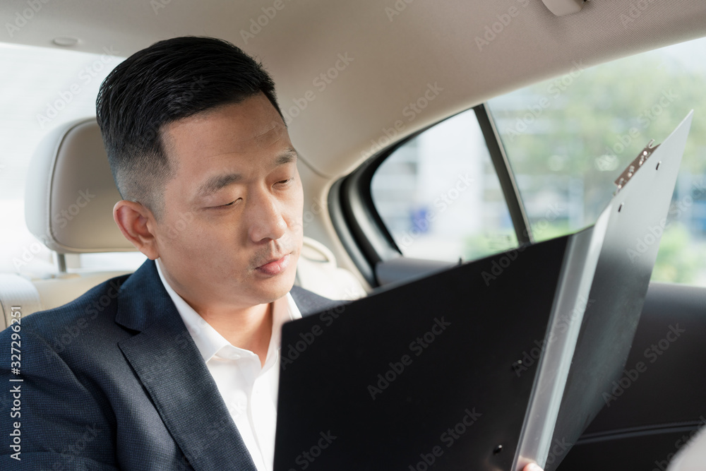 Asian business men work in cars