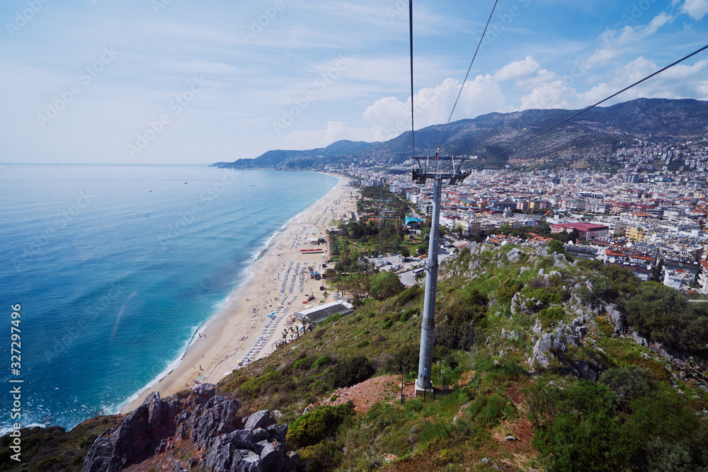 Fototapeta premium Cable car over Cleopatra beach in Alanya, Turkey. The cable car ride to the top of the castle.