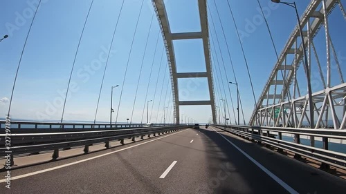 Driving along Crimean bridge through Kerch Strait to Crimea. Automobile and railway bridge connecting Taman and Kerch photo