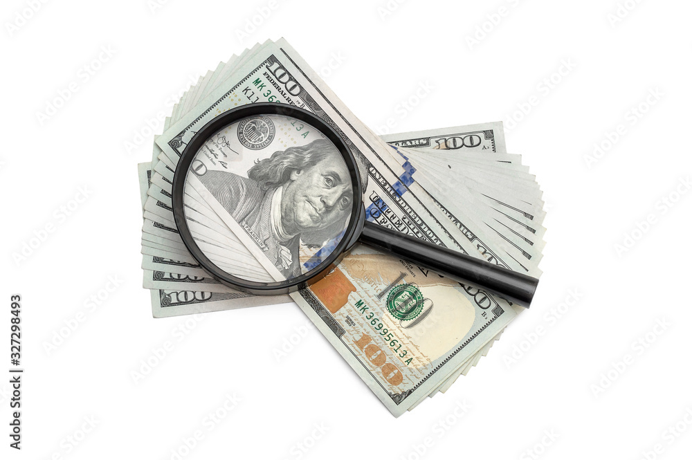 Magnifying glass with dollar bills on white. Business concept. Magnifying glass with dollar bills on white. Business concept.