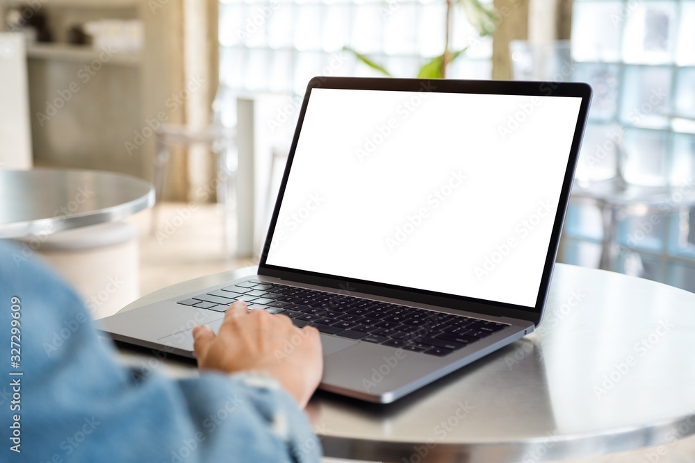 Mockup image of a woman using and touching on laptop computer touchpad with blank white desktop screen Mockup image of a woman using and touching on laptop computer touchpad with blank white desktop screen