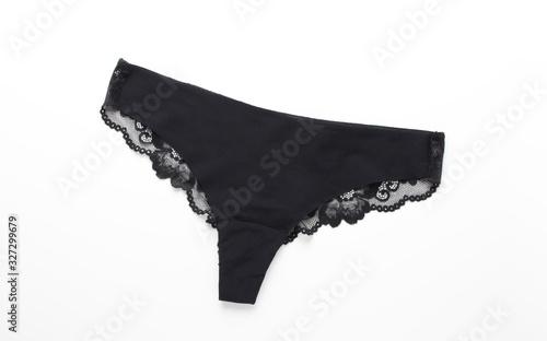 Black satin panties with lace on white background.Women's underpants on white background.Basic black lingerie,top view.
