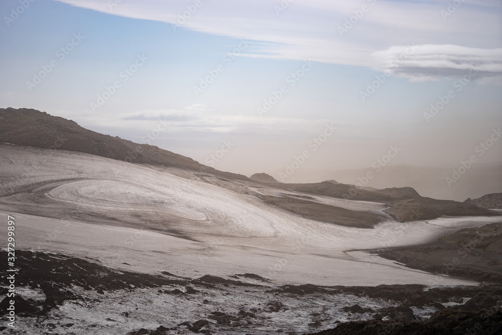 Volcanic landscape with glacier, rocks and ash on the Fimmvorduhals hiking trail. Iceland