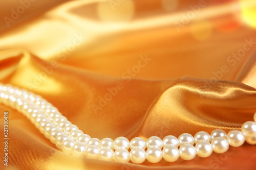 Wedding background. Satin with pearls